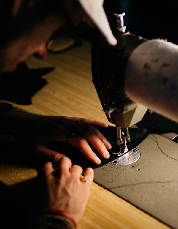 man working at sewing machine